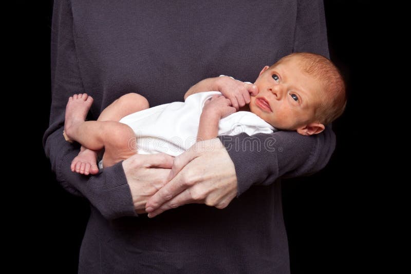 Baby boy in Mother s arms stock image. Image of hold - 10268643