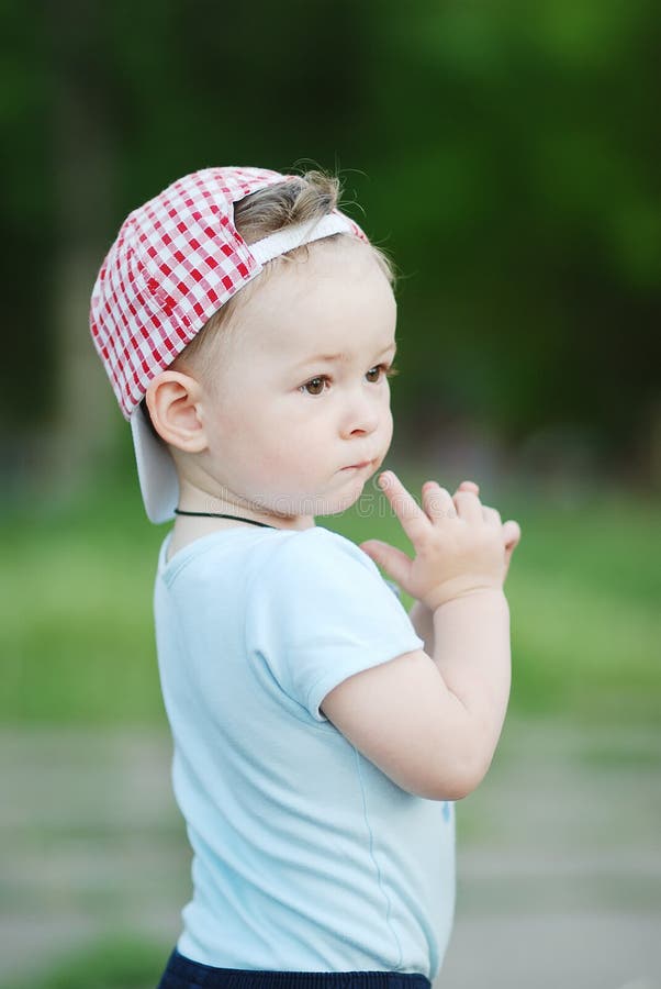Baby Boy in a Plaid Cap on a Green Background Stock Photo Image of