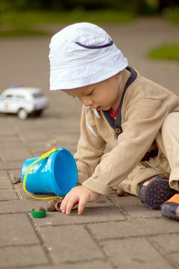 Baby Boy Playing on the Ground in The Park royalty free stock image Baby Boy Playing on the Ground in The Park royalty free stock image
