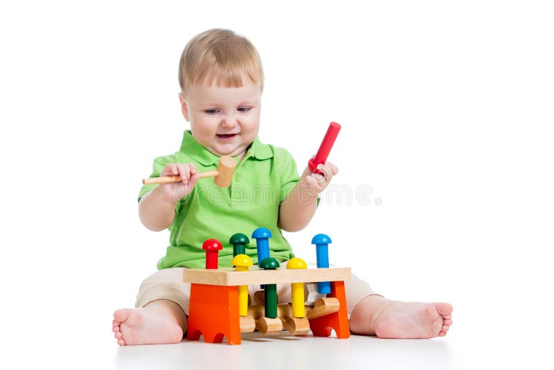 Baby boy playing with toy on white background stock photography