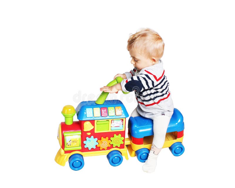 Baby boy playing with train toy royalty free stock photography Baby boy playing with train toy royalty free stock photography