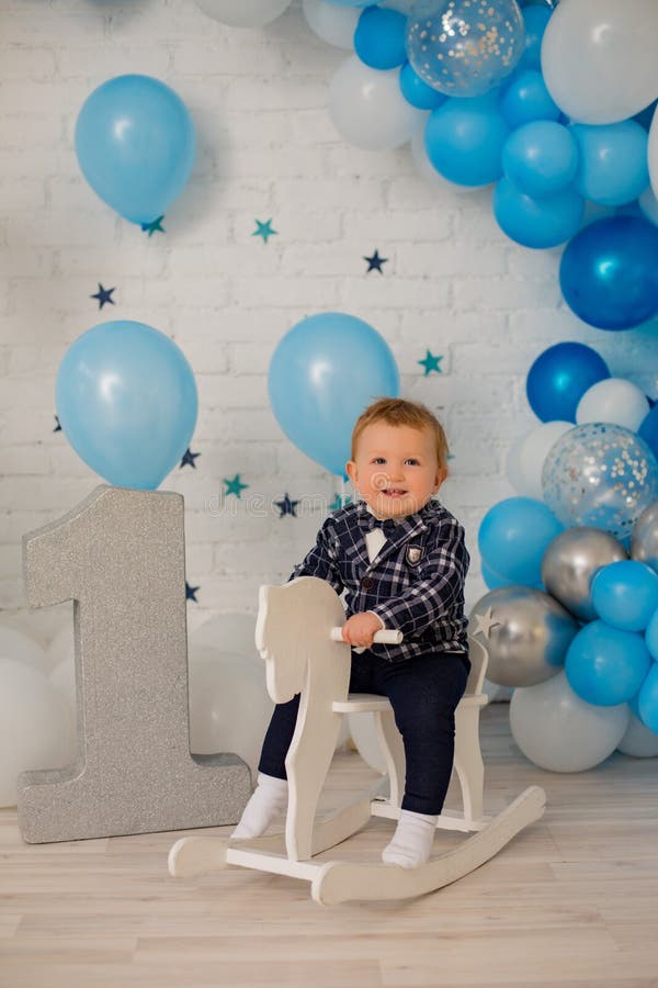 Baby boy ride toy horse stock photography