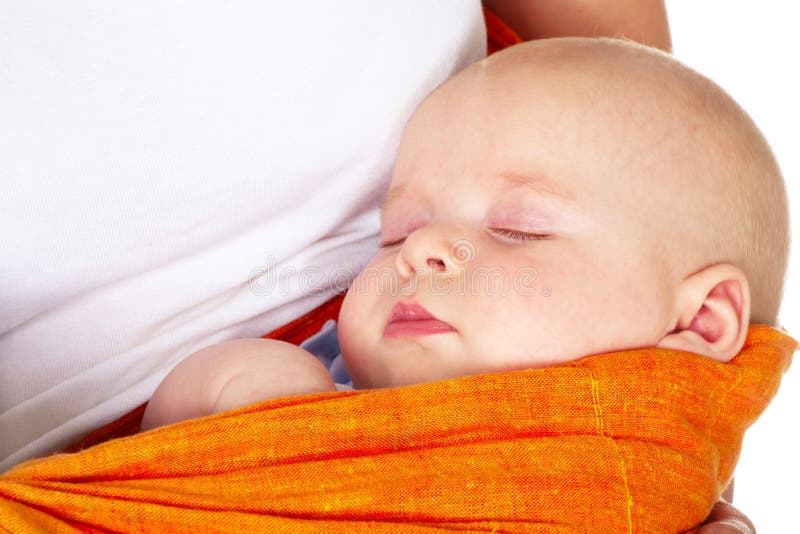 Baby boy sleeping in mother arms