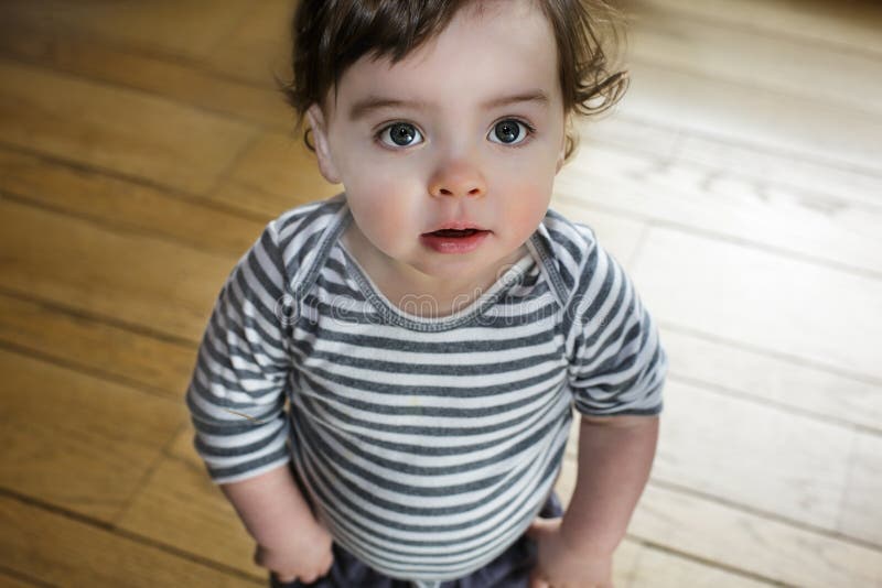 Baby Boy Standing Big Eyes stock image. Image of pretty - 28701023