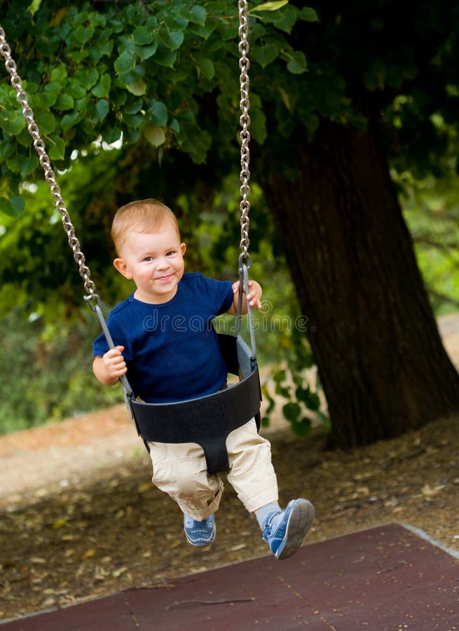Baby boy swings stock photo. Image of baby, cute, playground 2899642