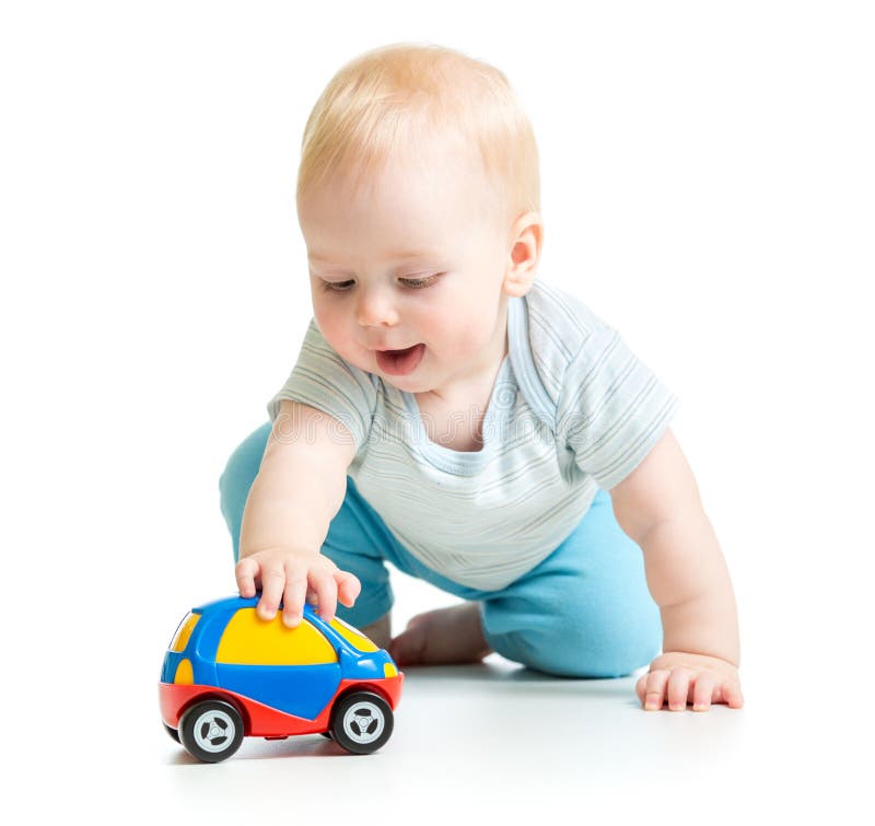 Baby boy toddler playing with toy car