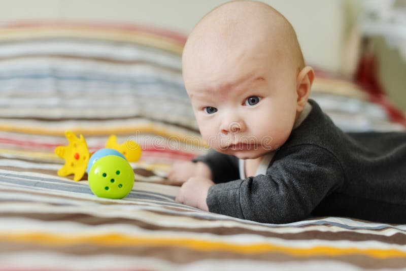Baby boy with toys royalty free stock image