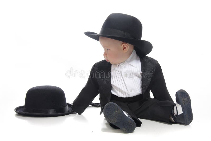 Baby boy in tuxedo and hat