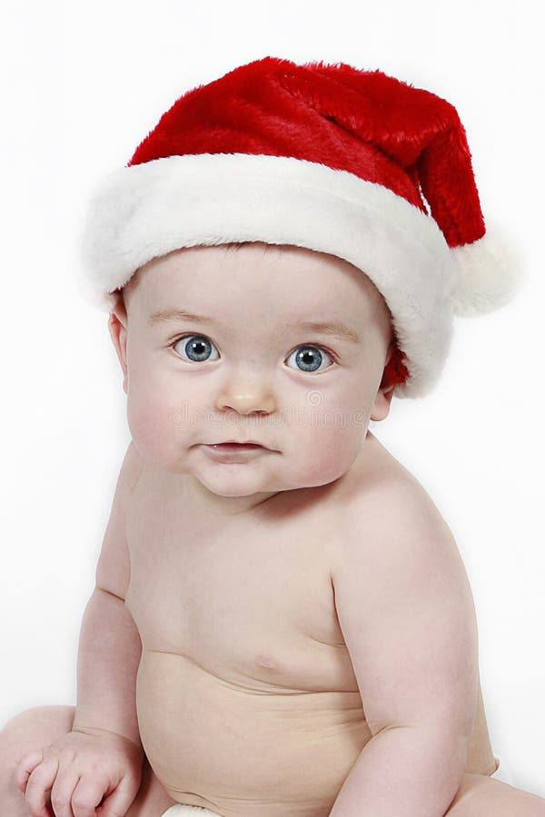 Baby boy wearing Santa hat