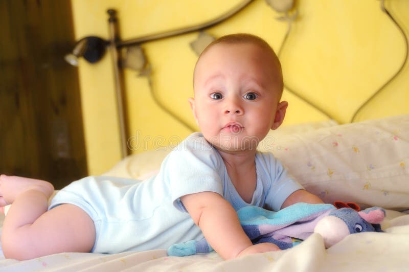 Baby Built on the Bed Looking Curiously Stock Photo Image of positive, beautiful 45397872