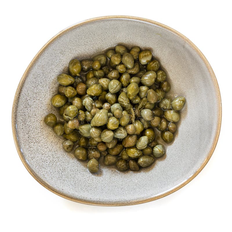 Baby Capers in Stoneware Bowl Top View Isolated on White stock photos