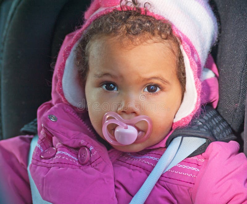 Baby in a car seat royalty free stock photography
