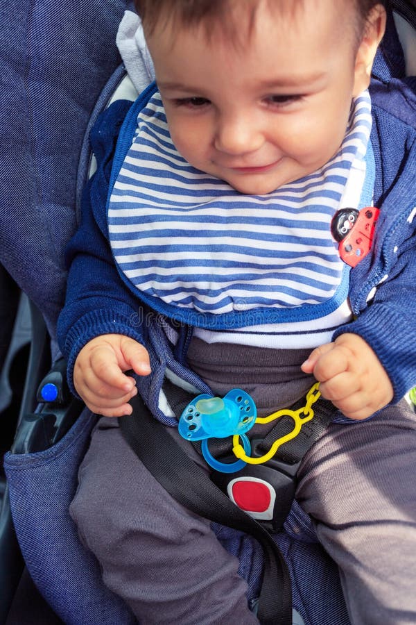 Baby car seat for safety. baby child sitting in car seat with safety belt locked protection. Protection in the car royalty free stock photos Baby car seat for safety. baby child sitting in car seat with safety belt locked protection. Protection in the car royalty free stock photos
