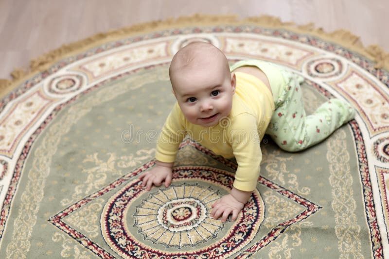 Baby on carpet stock image. Image of little, adorable 23688993