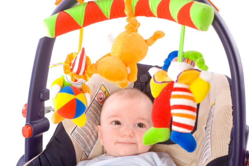 Baby carrier and toys stock image. Image of infant, boys 9935939