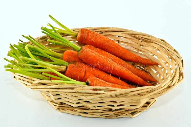 Baby carrots in wicker basket.