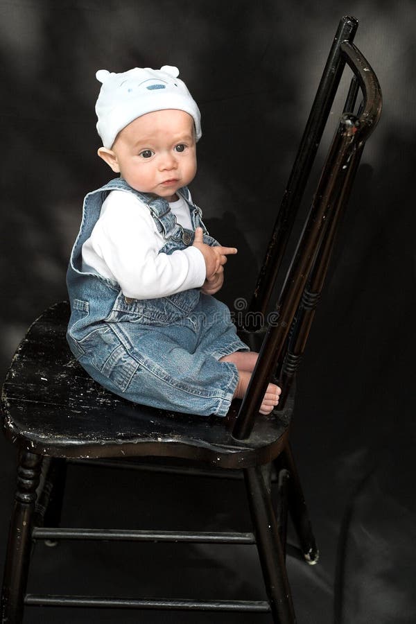 Baby on Chair stock photo. Image of gazing, denim, expressive 2187502