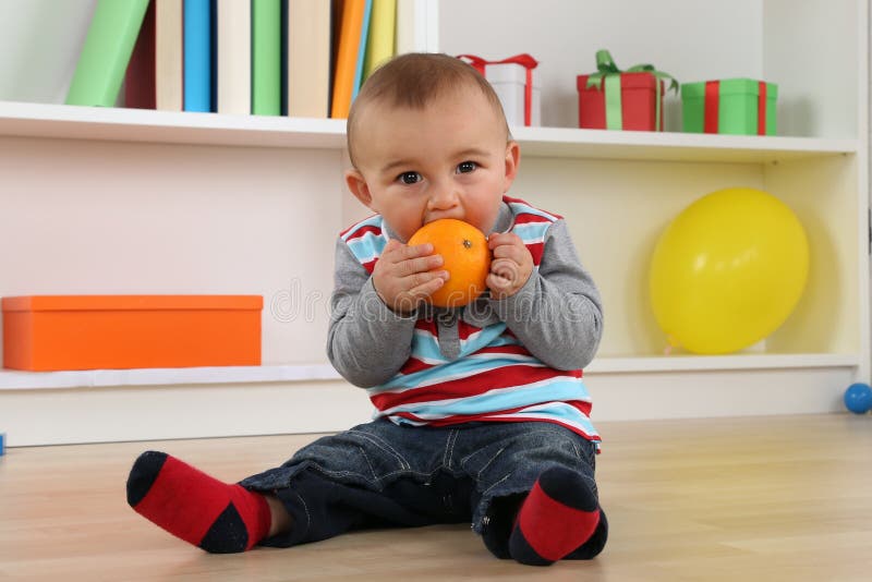 Baby Child Eating Orange Fruit Stock Image - Image of hunger, child