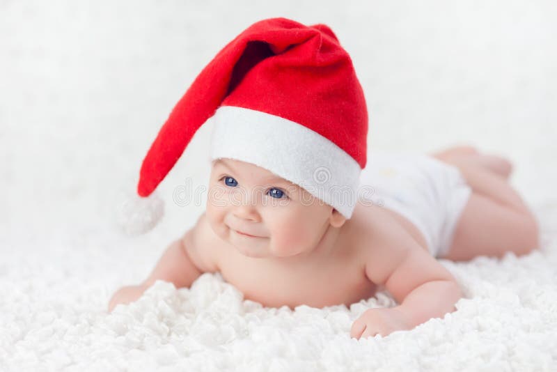 Baby in a Christmas cap royalty free stock photos