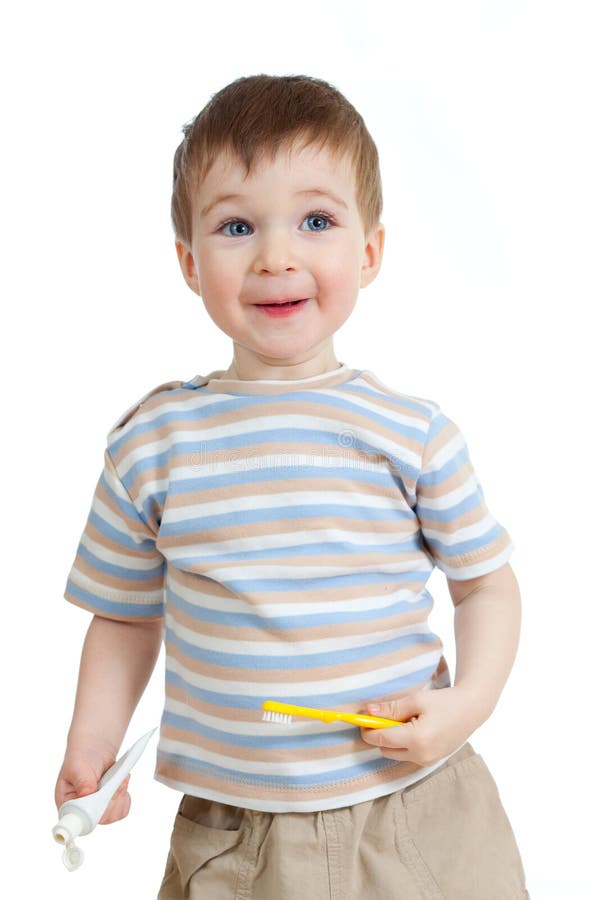 Baby cleaning teeth and smiling on white royalty free stock images