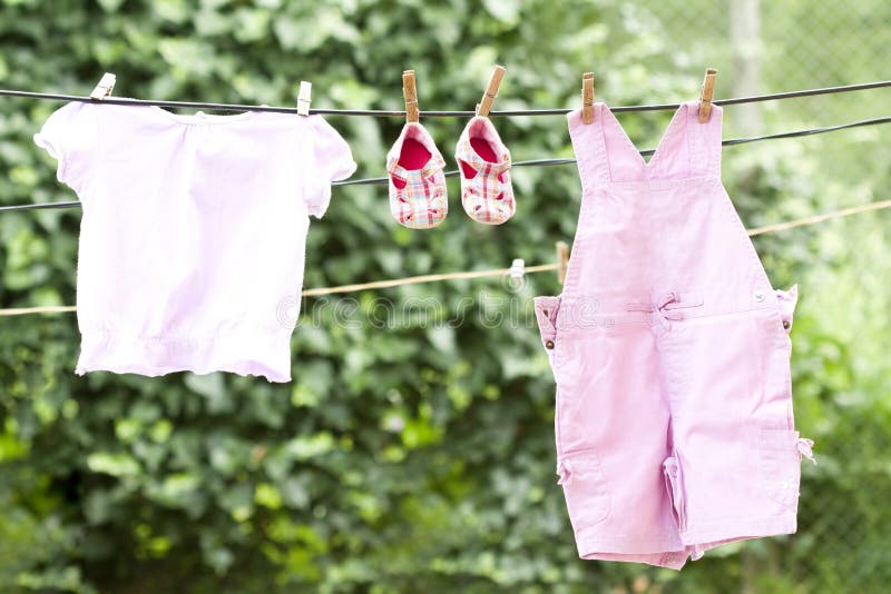 Baby clothes hanging stock image. Image of life, dirty 42474467