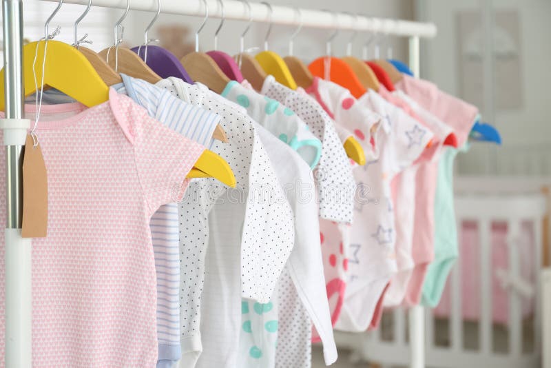 Baby Clothes Hanging on Rack in Store. Shopping Concept Stock Image