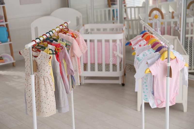 Baby Clothes Hanging on Rack in Store. Shopping Concept Stock Image