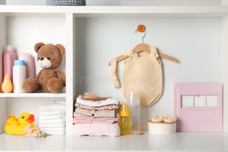 Baby Clothes, Toys and Accessories on White Rack Stock Photo Image of