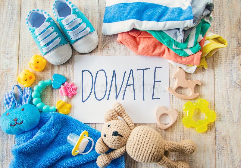 Baby Clothing and Donation Accessories. Selective Focus Stock Photo