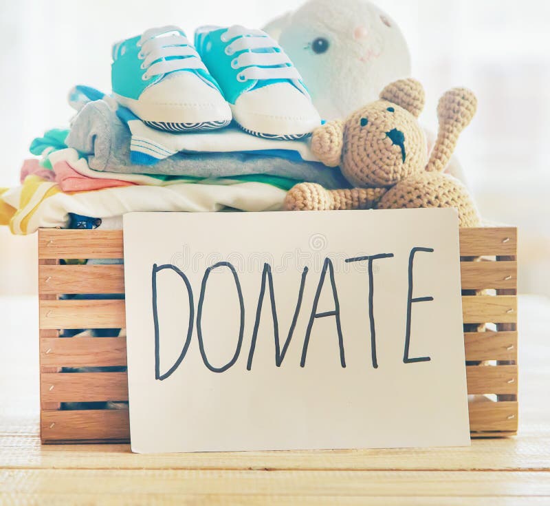 Baby Clothing and Donation Accessories. Selective Focus Stock Photo