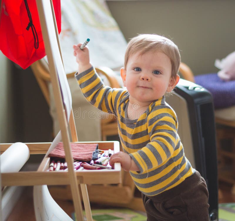 Baby Coloring on Easel stock image. Image of natural 71734749