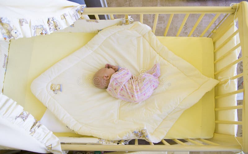 Baby in cot