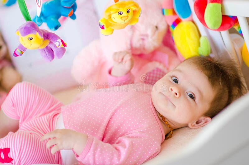 Baby in a cot stock photo. Image of fence, look, bedroom 76672738