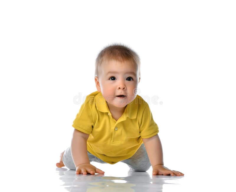 Laughing baby boy crawling over white. Baby Crawling over White Background, Happy Kid , Child Boy Crawl, White Isolated stock photography Laughing baby boy crawling over white. Baby Crawling over White Background, Happy Kid , Child Boy Crawl, White Isolated stock photography