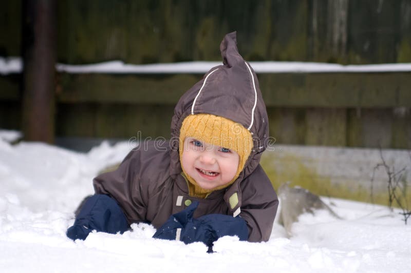 Baby crawling in snow