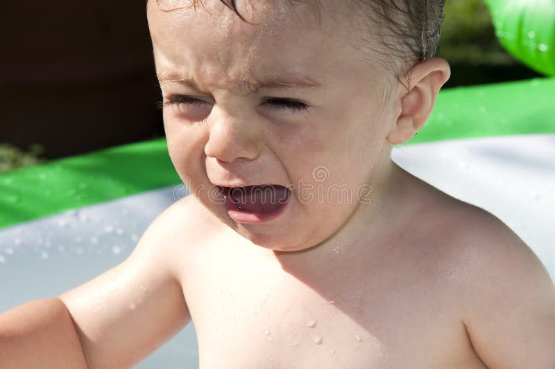 Baby cries because he does not want to wash