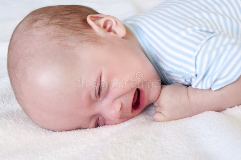 The Baby Cries and Pulls the Handle into His Mouth because of the