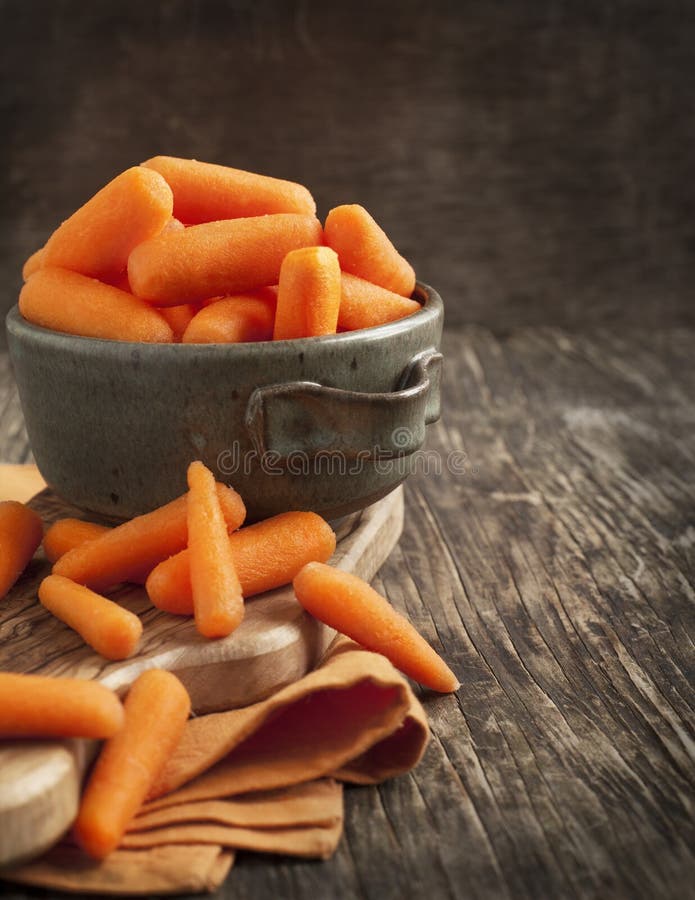 Baby cut carrots stock photos