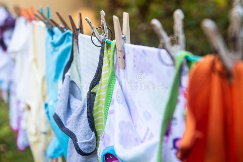 Baby Cute Clothes Hanging on the Clothesline Outdoor. Child Laundry Hanging  on Line in Garden Stock Image - Image of baby, fresh: 230878515