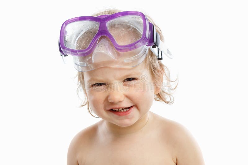 Baby diver in swimming mask with a happy face close-up portrait, on white