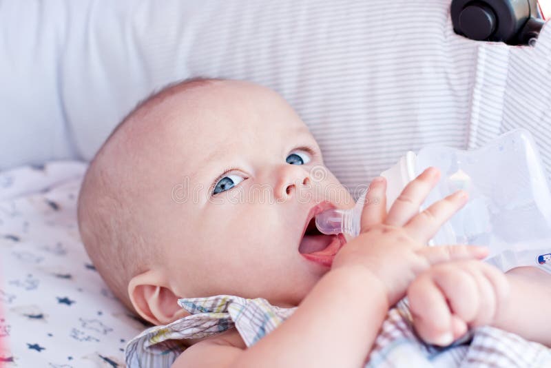 Baby is Drinking Water from Lying in a Stroller Stock Photo Image of
