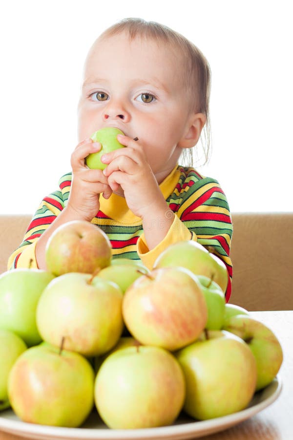 Baby eating apple