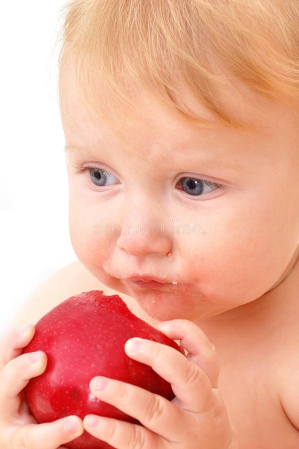 Baby eating apple stock image. Image of innocence, mouth 3078665