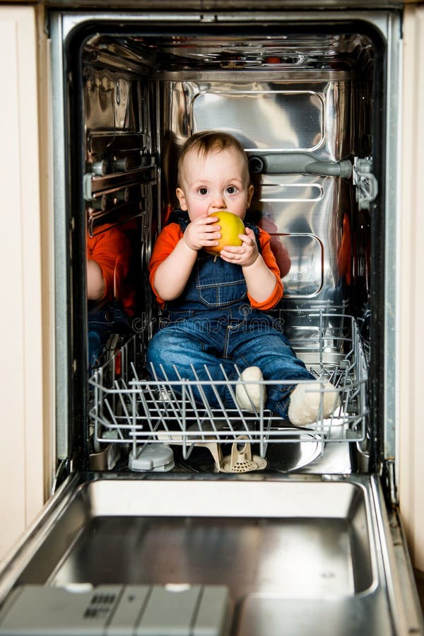 Baby Eating Apple in Dishwasher Stock Image Image of child, girl