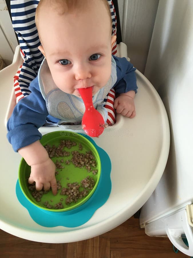 Baby eating stock image. Image of baby, buckwheat, eating 104439319