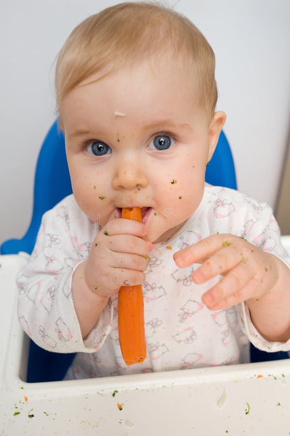 Baby eating carrot stock photo. Image of childhood, vitamins 38275592