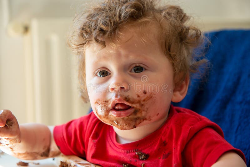 Baby is Eating a Chocolate Cake Stock Photo Image of dessert, making