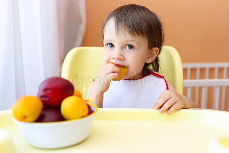 Baby eating fruits