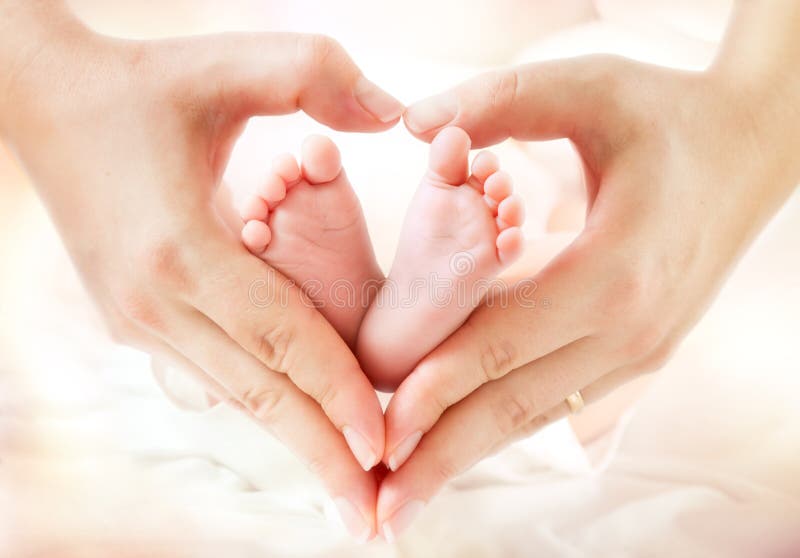 Baby feet in mother hands