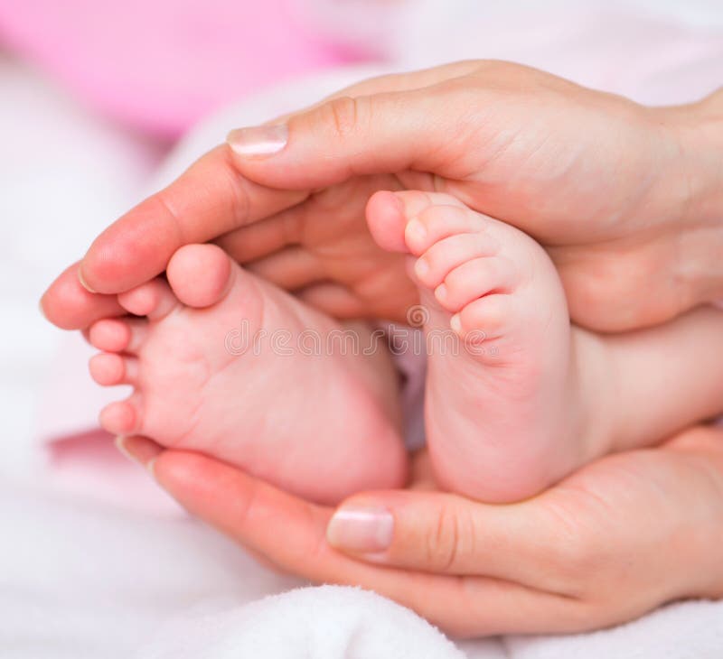 Newborn Baby Feet Parents Holding in Hands. Stock Photo Image of arms